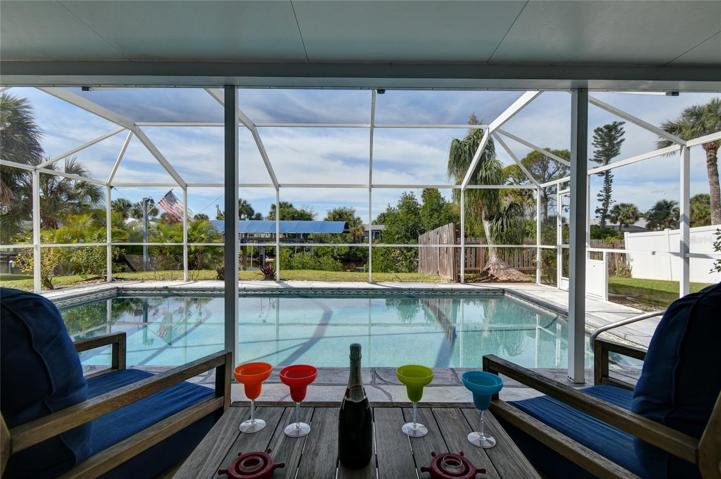 Enjoy the sunset overlooking pool and waterway.