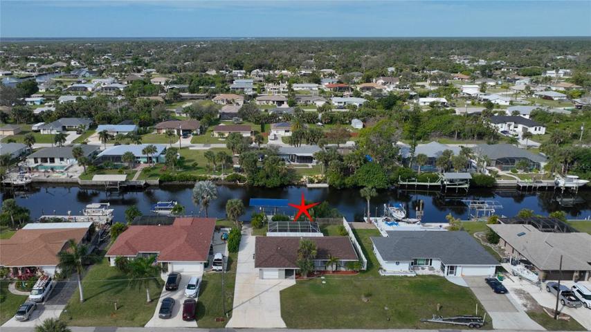 Beautiful street, delightful in-ground pool and excellent water frontage.