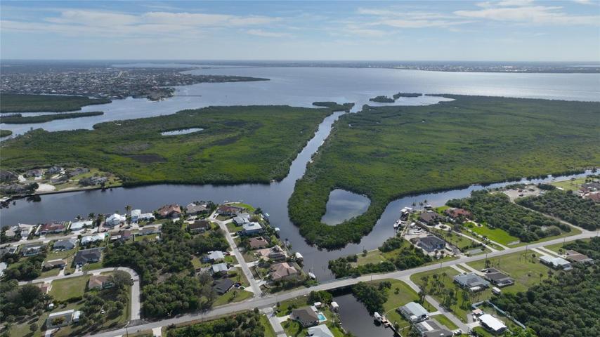 The best of Southwest Florida is the magnificent waterways and Charlotte Harbor leading out to the Gulf of Mexico.  Pictured is the one bridge on Midway Blvd between the waterfront home and the harbor..