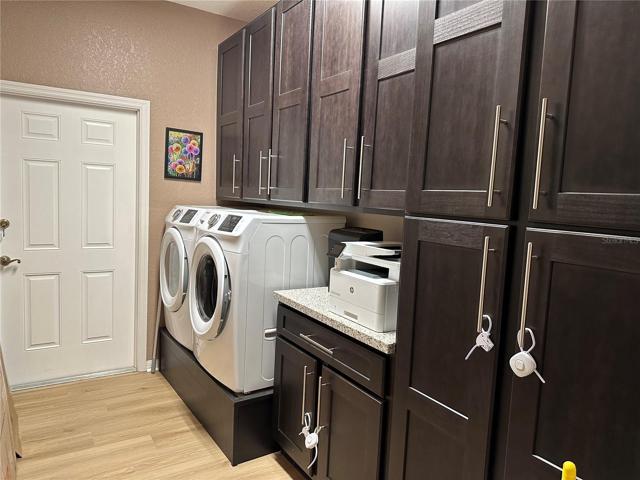 Laundry with front load W/D & tons of storage