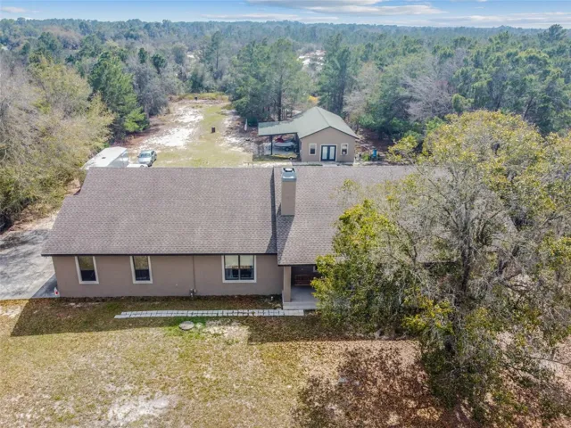 3372 SF home on over 2 acres surrounded by forest - building in back can be made into an in-law suite