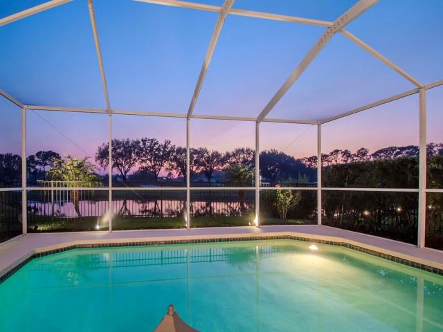 Back exterior view Direct West Sunset , waterfront , TPC golf course -hole 14 Direct west Sunset view from your pool area