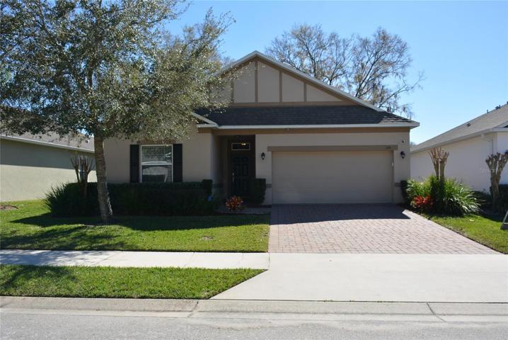 Good curb appeal with brick paver driveway, walk, and front porch