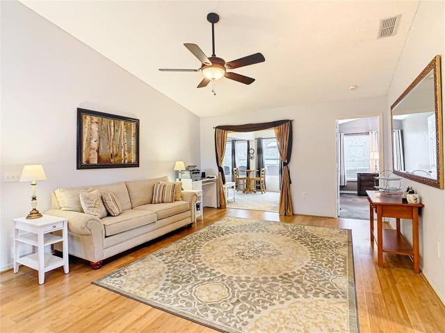 Living room opens to the family room  which opens to the pool area.
