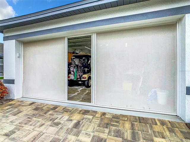 Walk-door in the open position with garage door up.