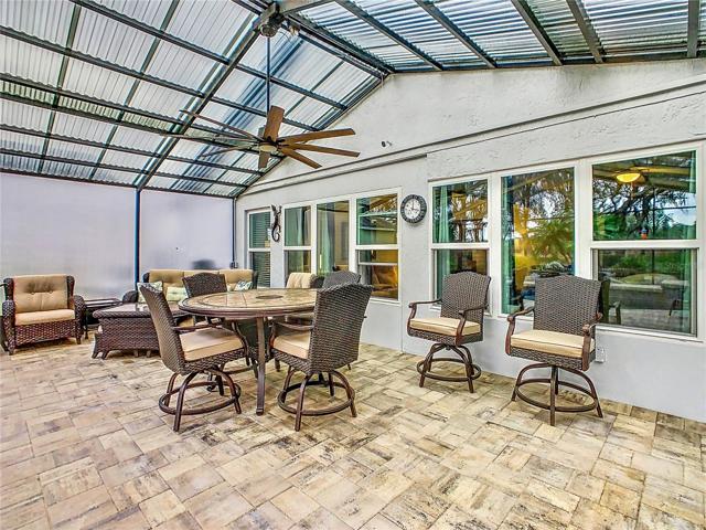 The covered patio with ceiling fan that allows you to enjoy your outside venue year-round