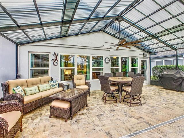 Covered patio with ceiling fan that allows you to enjoy your outside venue year-round; it’s the perfect place for entertaining family and friends.