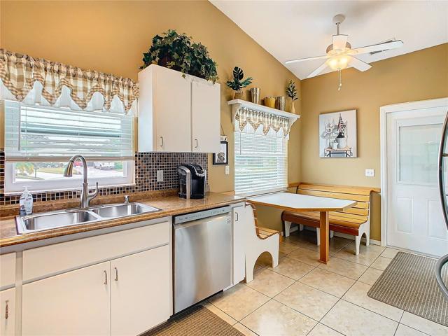 Window over the sink provides additional lighting plus a view.