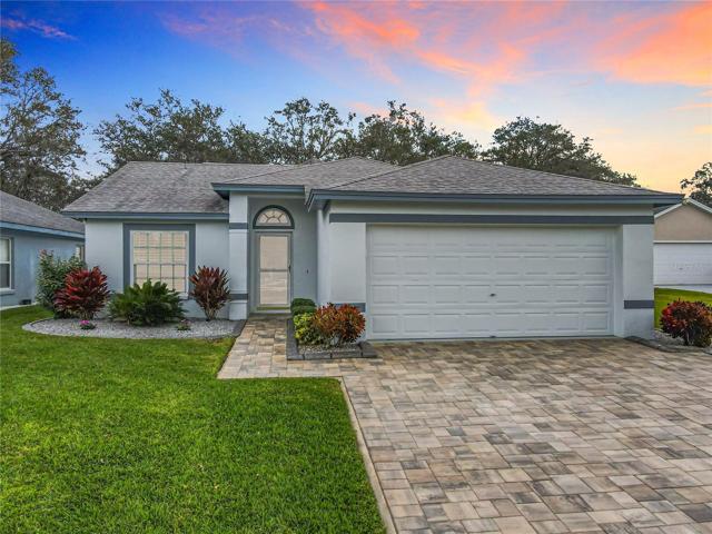 THIS BEAUTIFUL POOL home is located in the highly desirable, gated community of OAKWOOD GOLF CLUB.