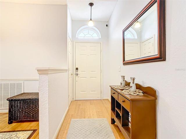 Foyer entry to the home with transom window to add additional light.