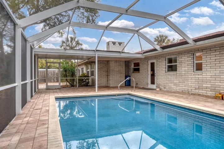 Screened Lanai with Pool and Seating Area