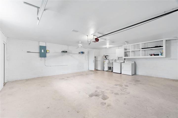 Garage with laundry and extra refrigerator
