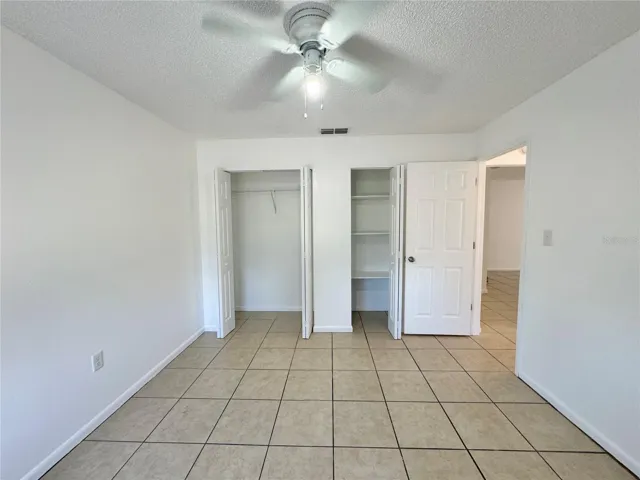 Primary bedroom with dual closets
