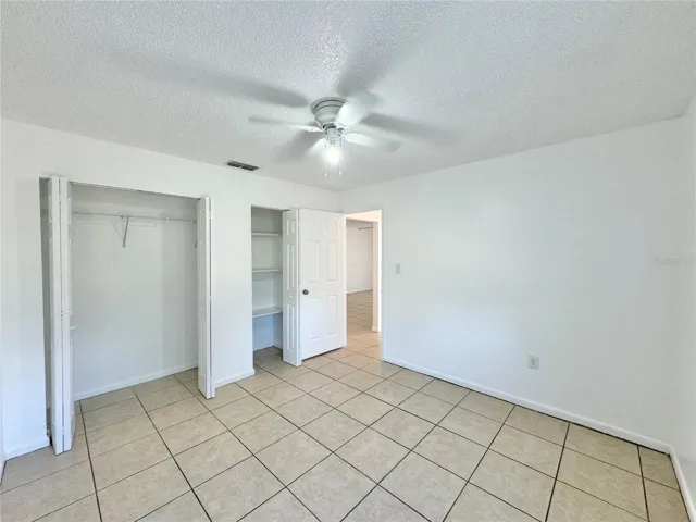 Primary bedroom with dual closets