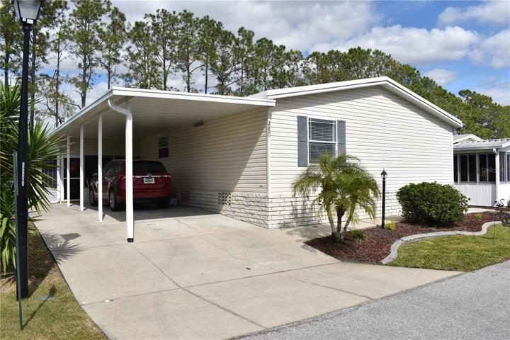 Well maintained property with large carport and golf cart storage and charging shed located in this desirable 55 plus golf commnity