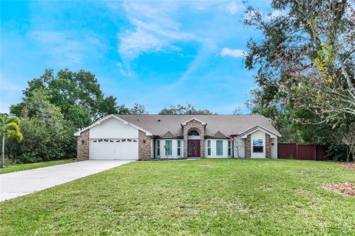 Front of home with huge front yard.