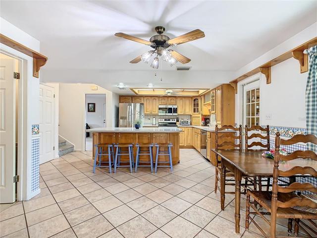 Kitchen, center island with breakfast bar and dinette area  compliment one another