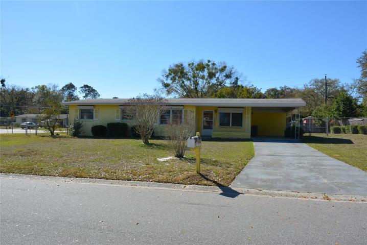 Built in 1961, this 3 bedroom 1.5 bath block home with terrazzo floors is brimming with potential