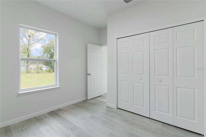 Bedroom 4 has a window facing the back yard