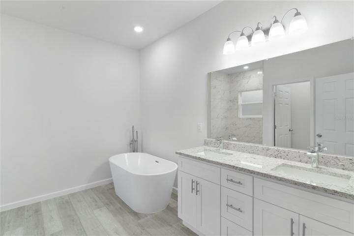 Wow! Look at the gorgeous tub,  and double sinks with lots of cabinet space