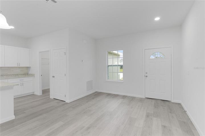 Front entrance area with kitchen and laundry to the left