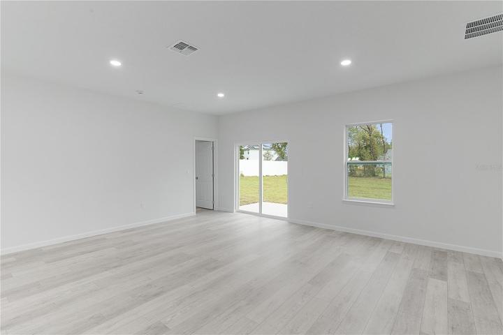Door to the left of sliding door leads into 4th bedroom