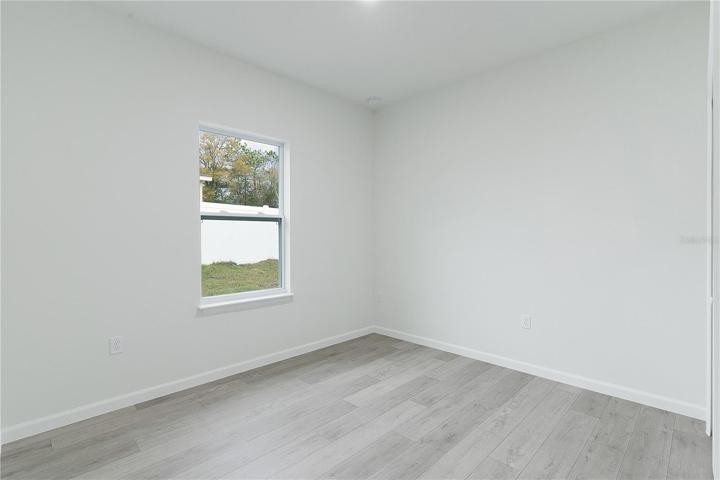 Bedroom 3 has a window facing the neighbors yard (left side of the house)