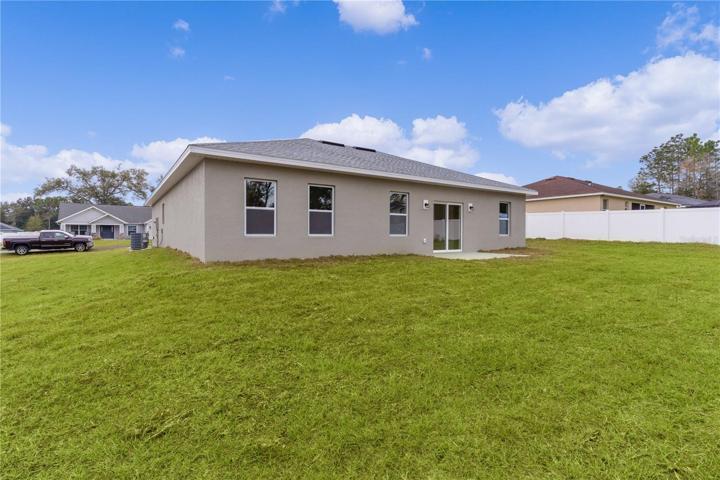 Looking at the rear of the house, the primary bedroom is on the left, living room in the middle, and 4th bedroom is on the right.
