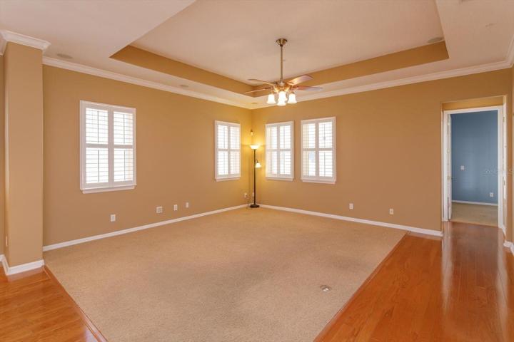Large family room with tray ceiling.