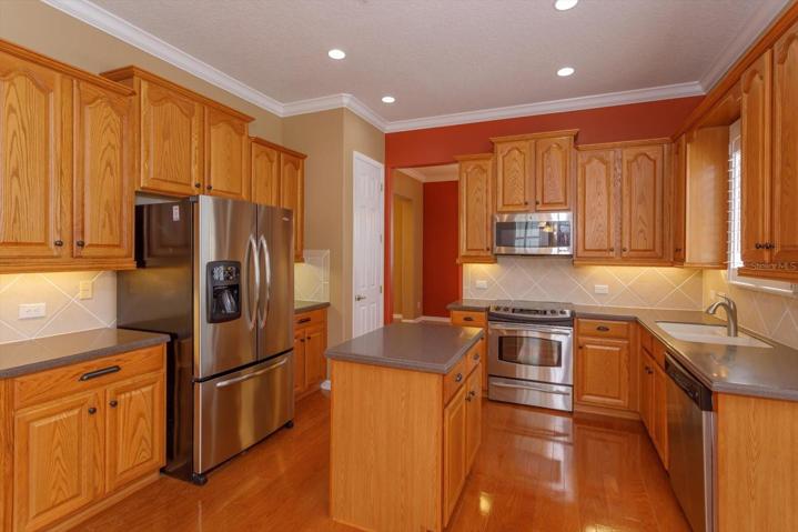 Large kitchen that has room for a dinette table and opens seamlessly into the expansive family room.