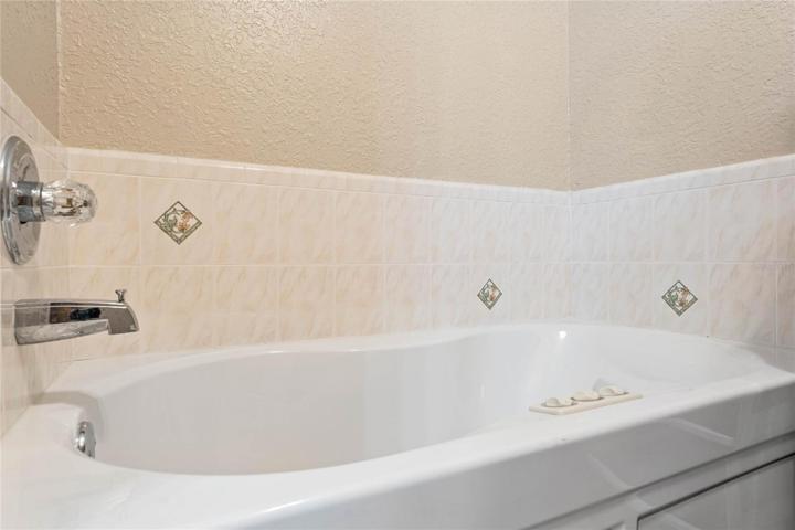 Soaking tub in primary bathroom
