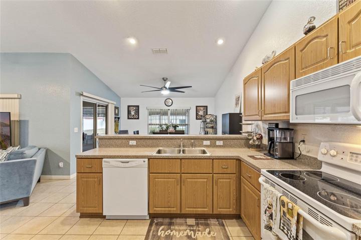 Kitchen includes eat-in area and connects with living room