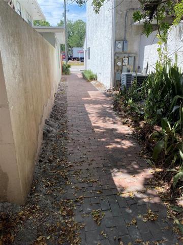 FROM PARKING TO BACK WALKWAY TO ENTRANCE ON LEFT