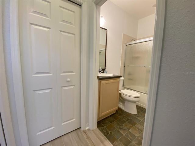 Hallway to Guest Bathroom. Linen Closet