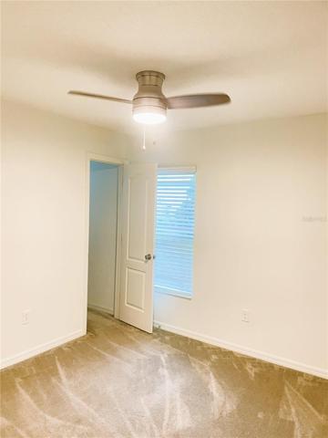 2nd bedroom with a small walking closet