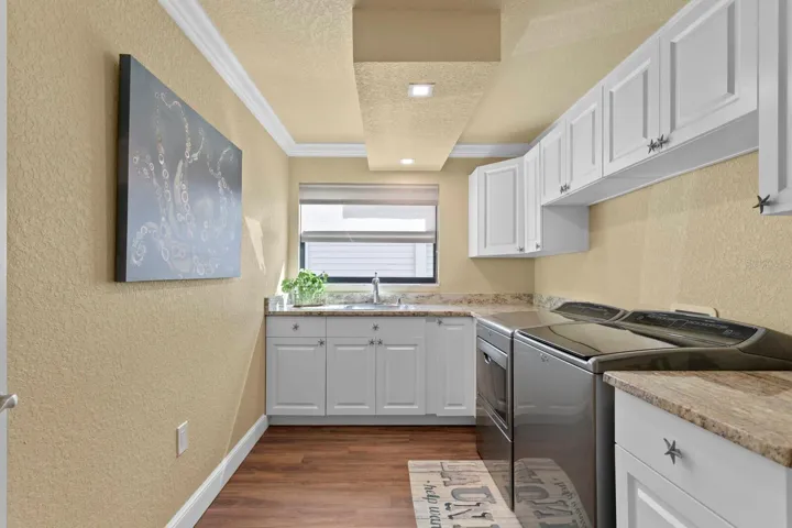 HUGE utility room with clothes hanging area (not shown).  Bright natural light through an additional window.