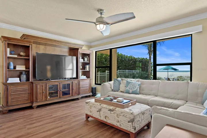 Downstairs living space, with newer windows and open area, large enough for multiple sitting groupings.