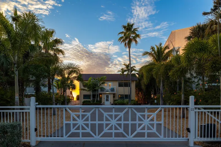 Nestled on one of the largest lots, .39/acre, with 63 ft of beach frontage to enjoy.  Private remote gate, including a coded entry for a pedestrian gate. Welcome Home!