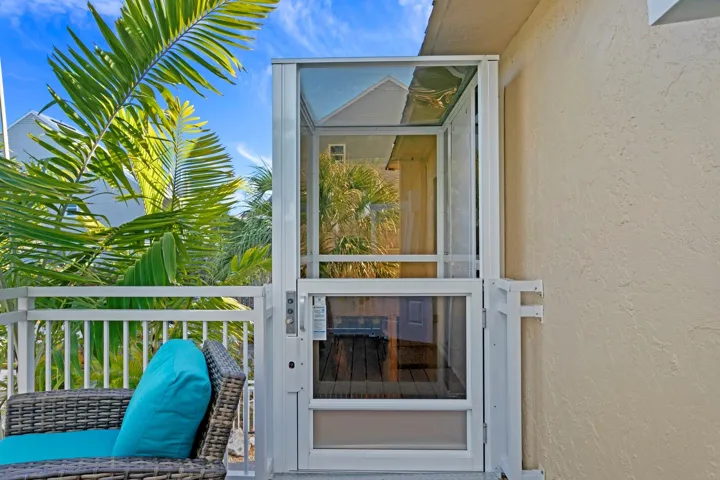 Elevator to second floor entrance and east facing balcony