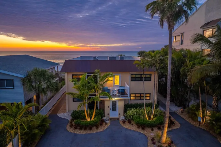 Evening lighting showcases the new tropical landscaping.