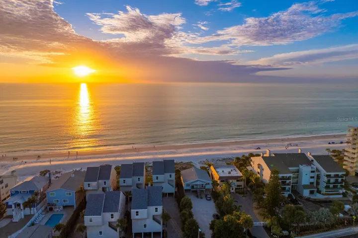 Amazing sunset and skyscape with aerial view of home.  Priceless location!