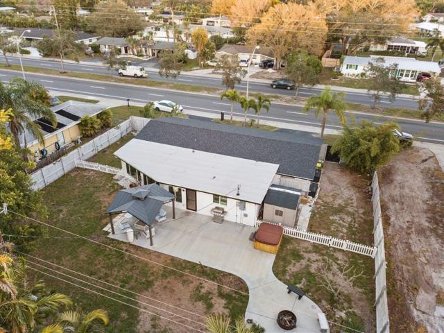 Aerial of the back yard showing the huge yard and new concrete patio