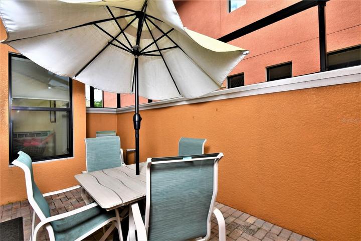 Privacy wall and screened cage patio
