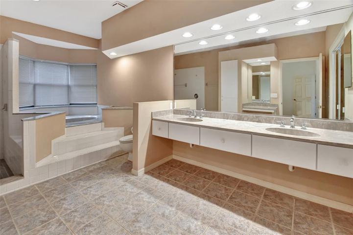 Master bath with garden tub and bay window and double sinks.