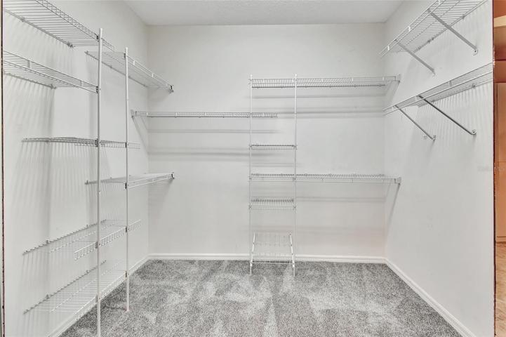 Spacious walk in closet in master bathroom