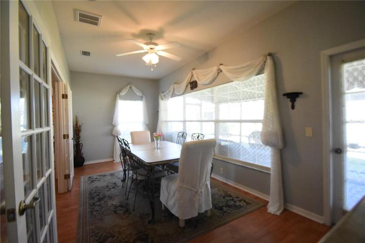 Dining room with large windows bringing in lots of natural light