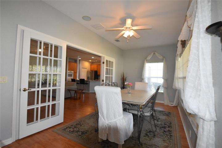 Large glass top dining table with 6 chairs conveys with home