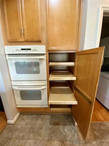 Pull out shelving in large pantry cabinet