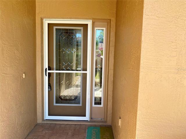 Front entry door with storm door and extra side window for light
