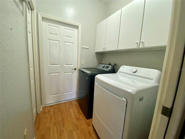 Laundry room with cabinet storage